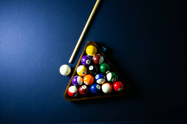 Blue felt billiards table with racked balls