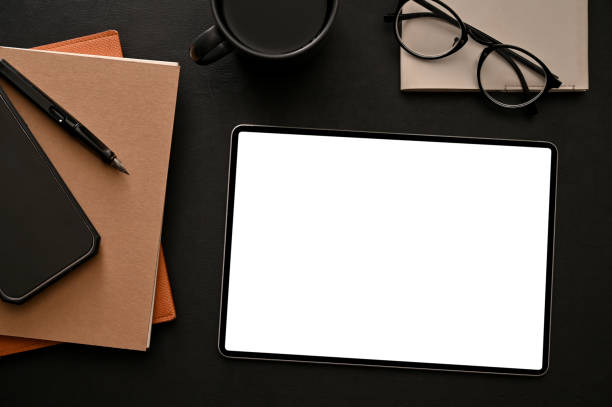istock Modern stylish black workspace background with tablet white screen mockup and stuff. 1396783658