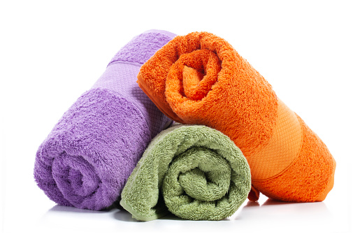 Colorful towels isolated on white background.