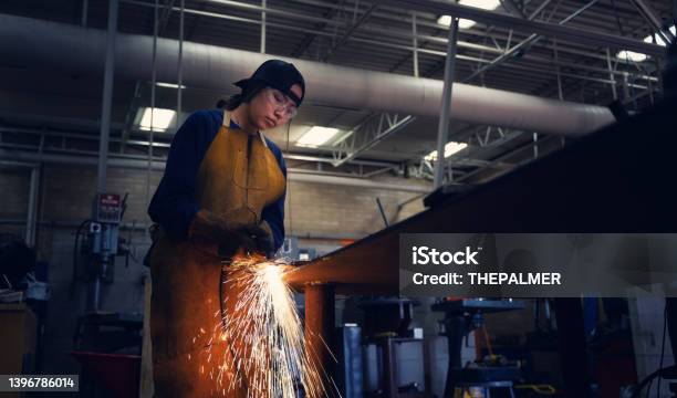 Female Teenager Practicing Torch Cutter Skills Stock Photo - Download Image Now - Welder, Learning, Cutting