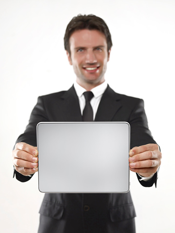 businessman holding a digital computer