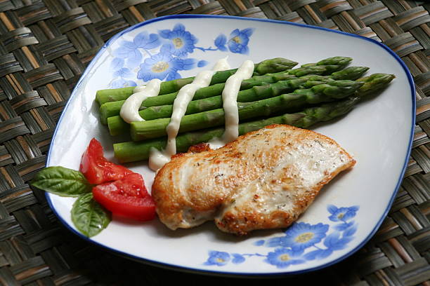 asparagus and chicken breast stock photo