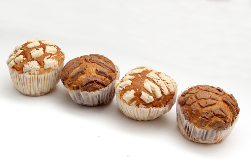 Mexican sweet bread Manteconchas vanilla and chocolate flavor cupcake type made with butter that is sold in bakeries in Mexico originating in Querétaro