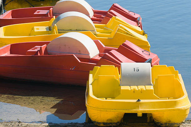 istock Red and yellow pedalos 139679056