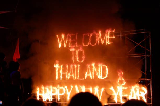 Fire show at the crowded Full moon party on Hat Rin beach in Koh Phangan island, Thailand