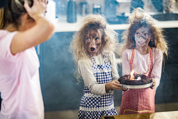 istock Whops, we have burnt the cake mommy! 1396793023