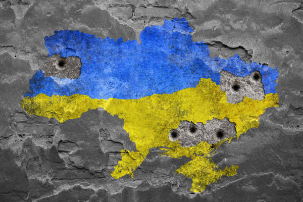 Ukrainian colors on damaged wall damaged wall 2022 russian invasion of ukraine stock pictures, royalty-free photos & images