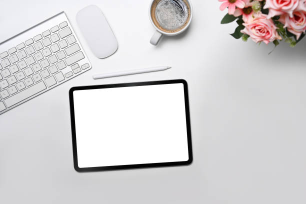 istock Minimal workplace with digital tablet, coffee cup and flower pot. Flay lay, Top view. 1396799081