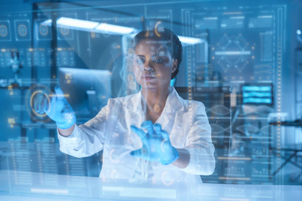 istock A young African-American scientist works with HUD or graphic display in a modern laboratory 1396801859
