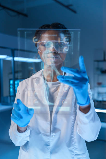 istock A small graphic display with a human body image and a scientist or a doctor, working with it, standing behind that display in a modern laboratory 1396801906