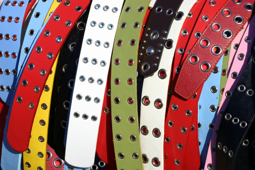 Several large multicolored women's belts.