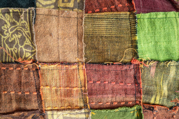 istock Recycling work at a professional dump woven fabric sewn together 1396803524