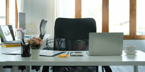 istock Bright modern workplace with laptop computer and office supplies. 1396806432