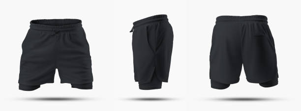 istock Mockup of black loose sport shorts with compression lining, 3D rendering, isolated on background, front, back, side view. 1396806568