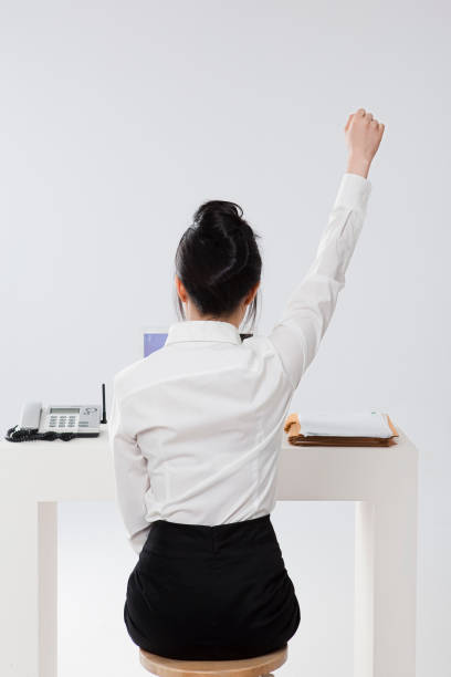 istock back view of woman in suit 1396809068
