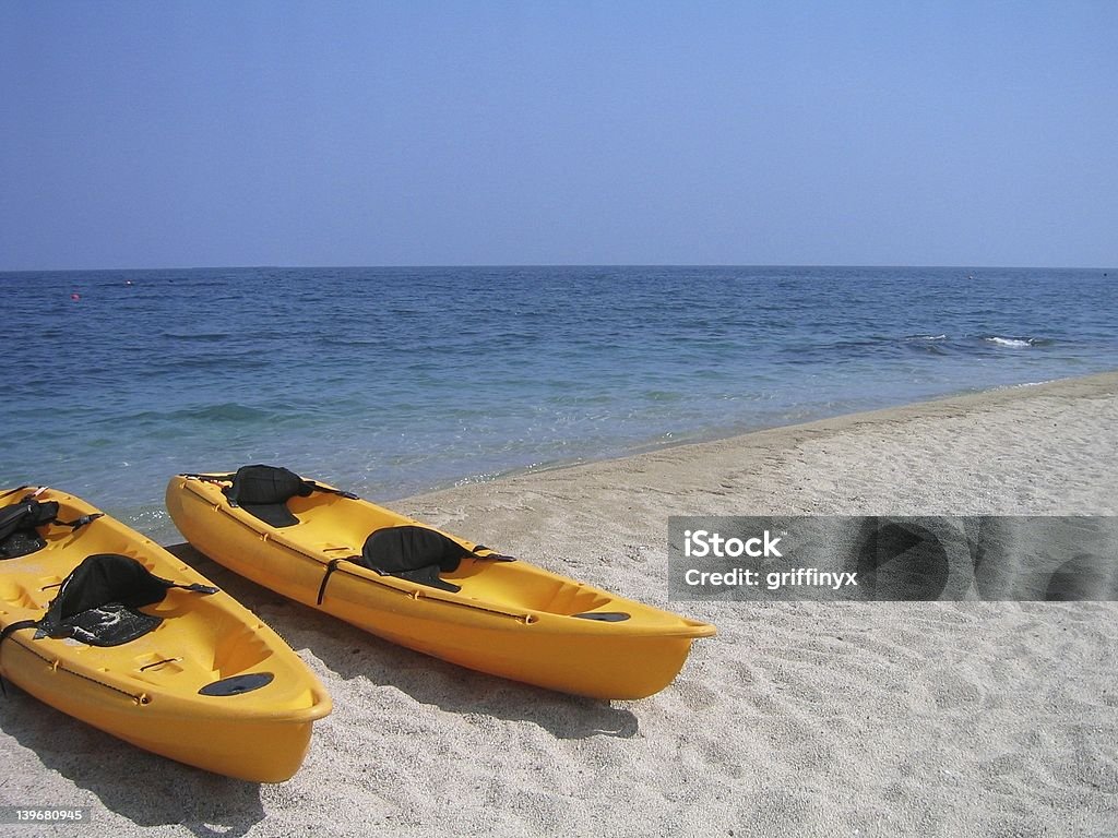 Boats Ashore A couple of boats by the sand. Activity Stock Photo