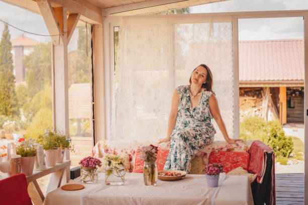 istock A woman is having breakfast on the terrace. 1396809467