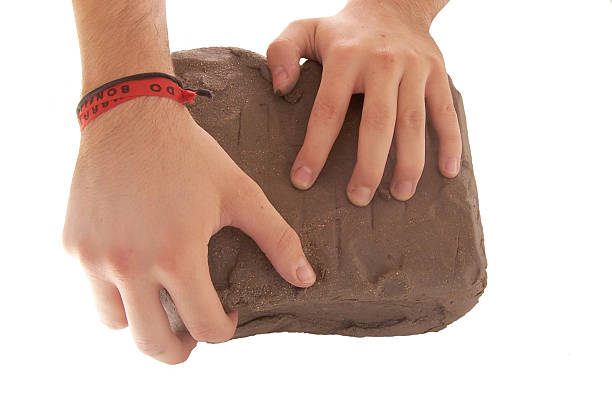 Hands molding clay stock photo