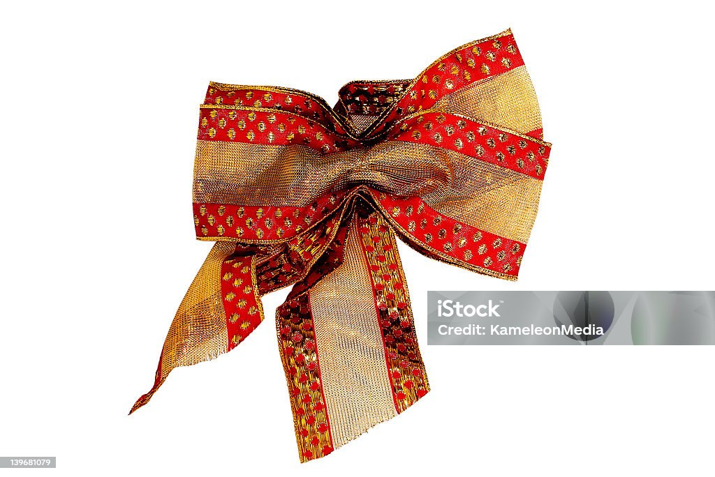 Christmas Bow Red and gold christmas Bow isolated on white background. Celebration Stock Photo