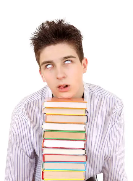 Annoyed Teenager with the Books Isolated on the White Background