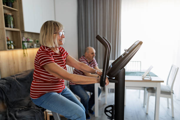 istock Senior couple exercising at home 1396813057