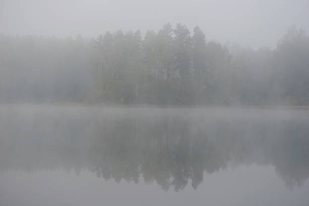 istock Lake in morning fog 139681467