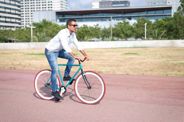 istock young hipster man riding fixed gear bike 1396815567