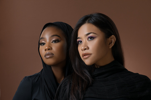 Two Beautiful Muslim Women of differing ethnicity in a studio shot