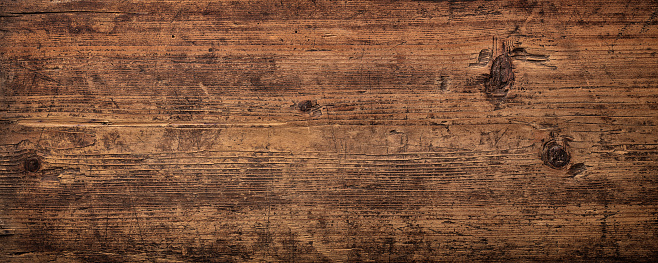 Dark wooden background with natural wood texture.