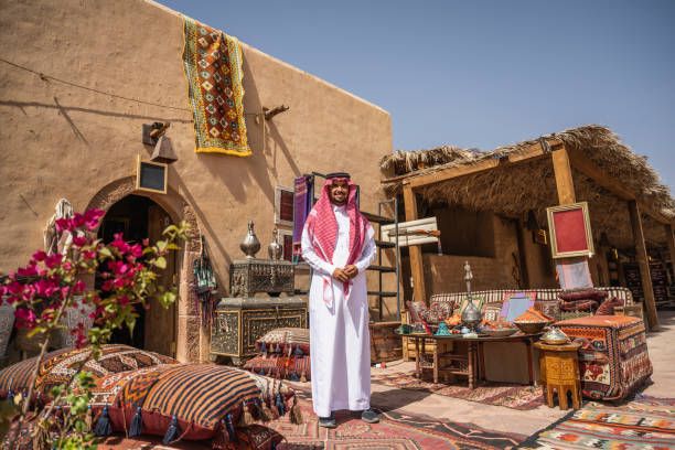 istock Saudi merchant standing outdoors with products for sale 1396818956