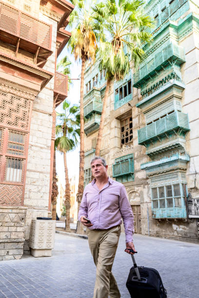 istock Mature business traveller experiencing Historical Jeddah 1396818995