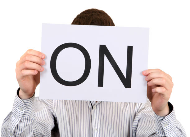 istock Person hold slogan ON 1396819922