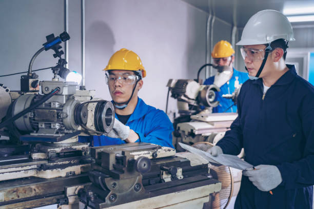 istock Finishing metal working on high precision CNC grinding machine in workshop. 1396820198