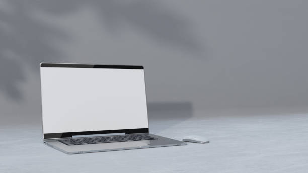 istock Empty display laptop with decoration minimal. Shadow from tree on cement floor. Mock-up computer and minimalism concept. 1396820216