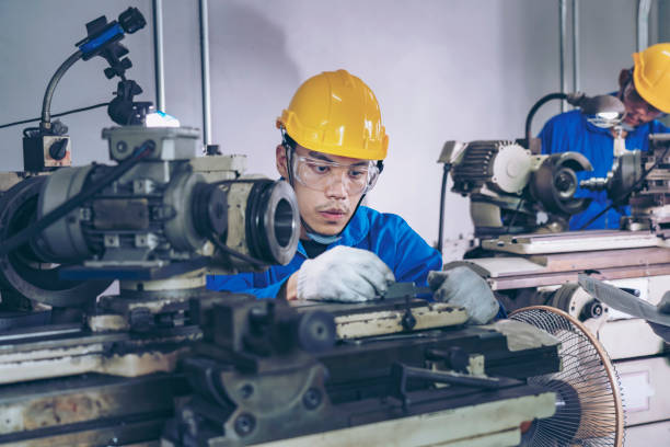 istock Finishing metal working on high precision CNC grinding machine in workshop. 1396820233