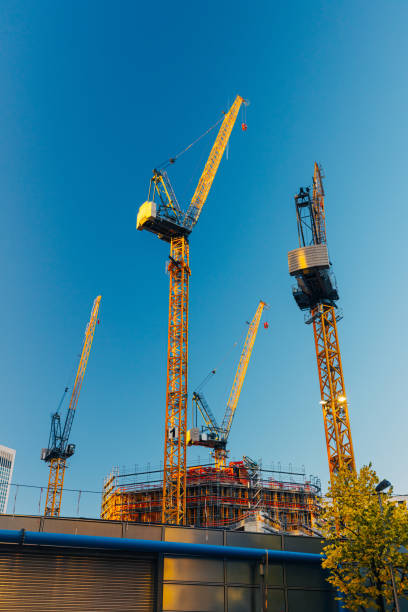 istock Cranes agains blue sky, public housing in development in Frankfurt am Main 1396820343