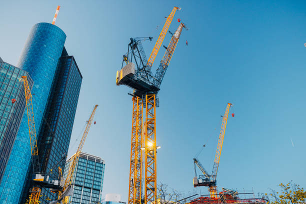 istock Cranes working on construction site in financial district in Frankfurt am Main 1396820352