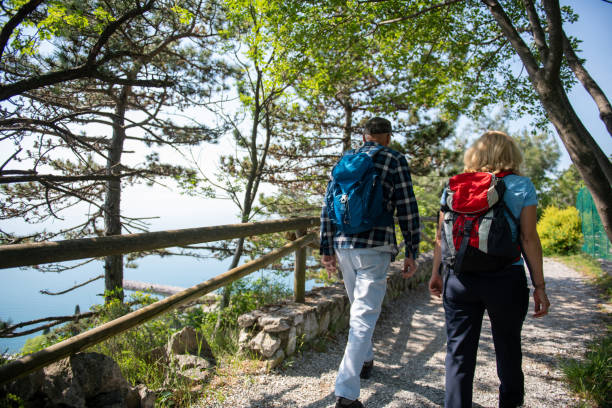 istock Seniors hiking by the sea 1396821174