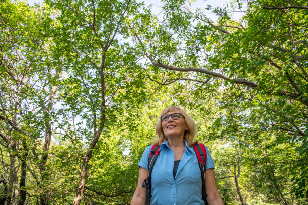 istock Senior woman hiking 1396821198