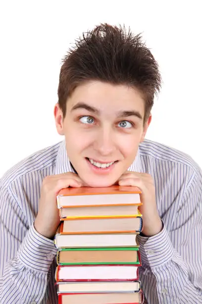 Funny Teenager with the Books Isolated on the White