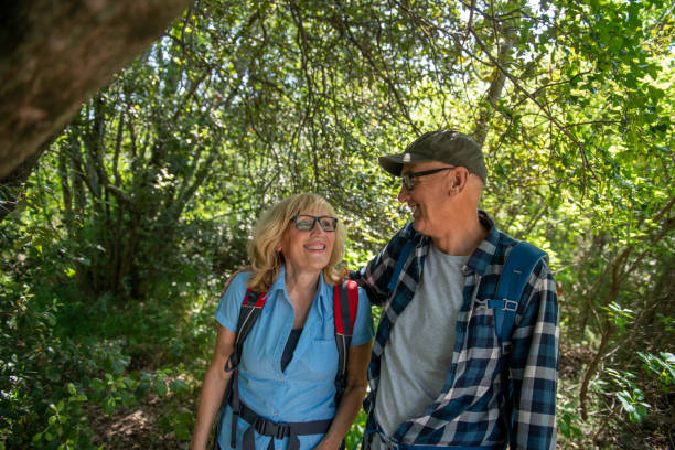 istock Seniors hiking in the forest 1396821271