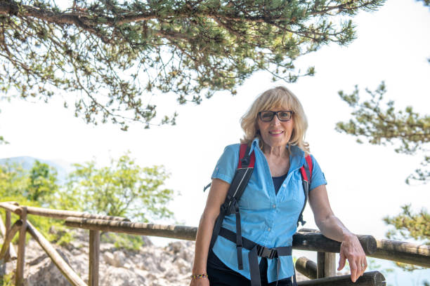 istock Senior woman hiking 1396821520