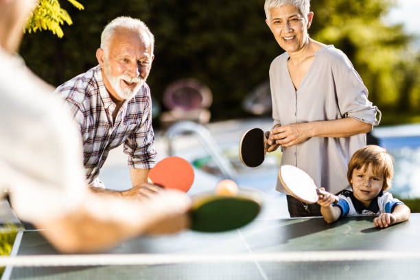 istock Playing table tennis in the backyard! 1396821547