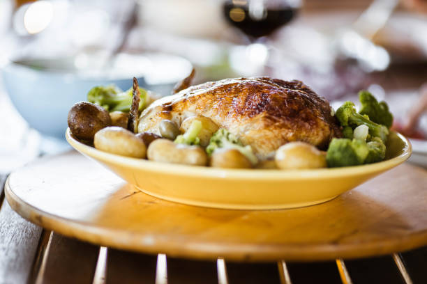 Close up of a restaurant meal of roast Chicken and gravy.