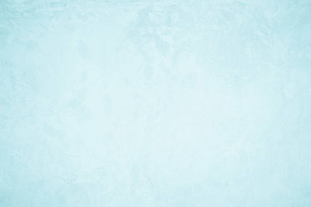 Pastel blue and white concrete stone texture for background in summer wallpaper. Cement and sand wall of tone vintage. Concrete abstract wall of light cyan color, cement texture mint green for design.