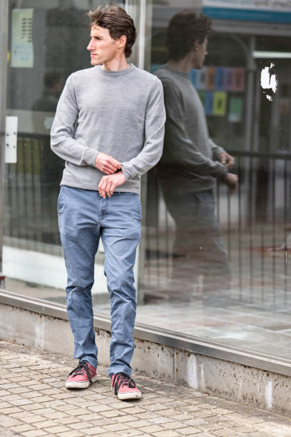 istock Man in his 30s standing by an empty shop 1396824403