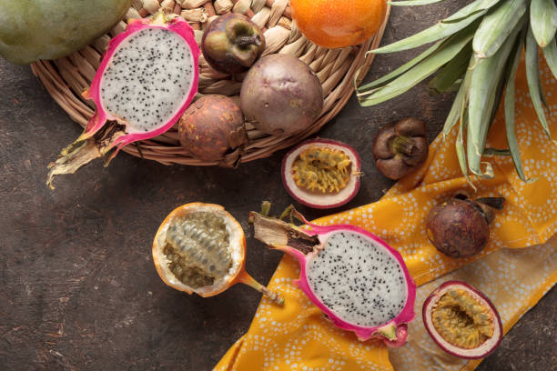 istock Tropical fruits on a dark background 1396824429