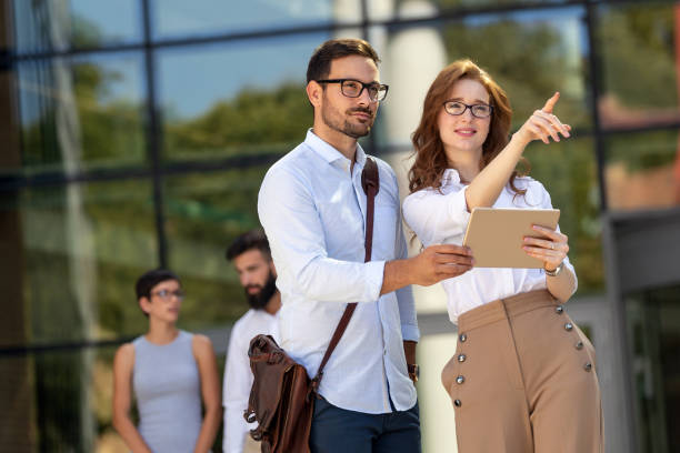 istock Group of business people using a digital tablet together, meeting and teamwork concept. 1396824753
