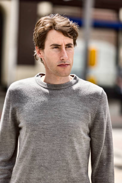 istock Man in his 30s walking down the street 1396824857