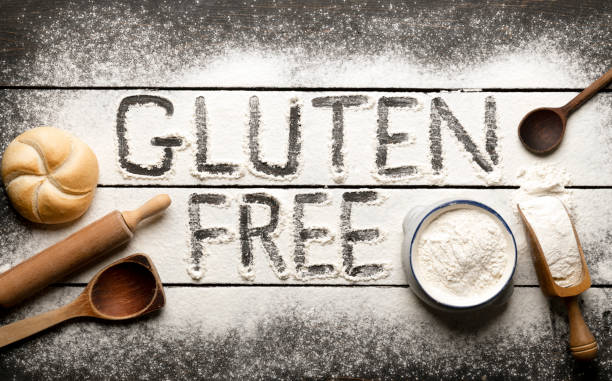 istock Gluten free bread ingredients and utensils on wood frame background 1396824951